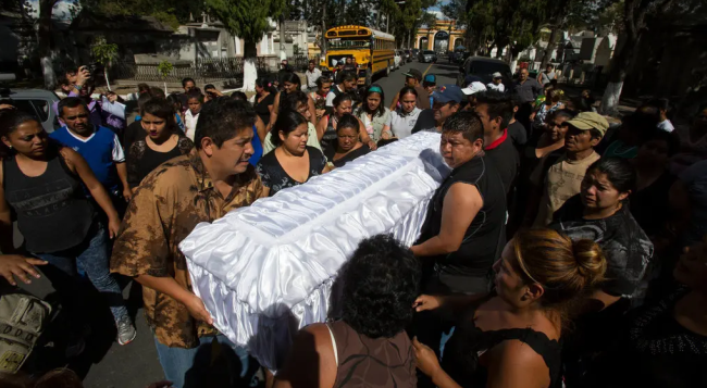 Family carrying casket