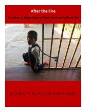 a child on a leash tied to metal bars
